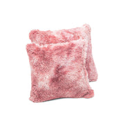 The Juego de Cojines de Lujo Flamenco by Intima Hogar features two soft, square, fluffy pink throw pillows—perfect for adding a chic touch to any space. One is set slightly in front of the other against a white background.