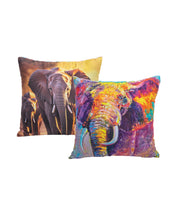 The Cojín Elefante by Intima Hogar includes two square cojines: one with a realistic elephant photo, the other with a colorful abstract elephant on white. Ideal as cojines suaves to add comfort and style to any room.