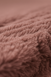 Close-up of soft, fluffy, pinkish-brown fabric with textured fibers and gentle waves—ideal for creating Cojines de Lujo Liverpool by Intima Hogar.