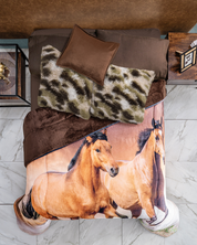 A neatly made bed showcases the Intima Hogar Juego de Cojines de Lujo Finlandia in brown and green, paired with a brown throw and horse-themed comforter. Nightstands with decor sit on a white tiled floor.