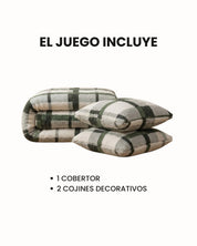 The Juego de Cobertor Flannel Ligero Ottawa by Intima Hogar is shown folded with two matching pillows. Above, it reads EL JUEGO INCLUYE; below: 1 COBERTOR y 2 COJINES DECORATIVOS. Ideal para el invierno.